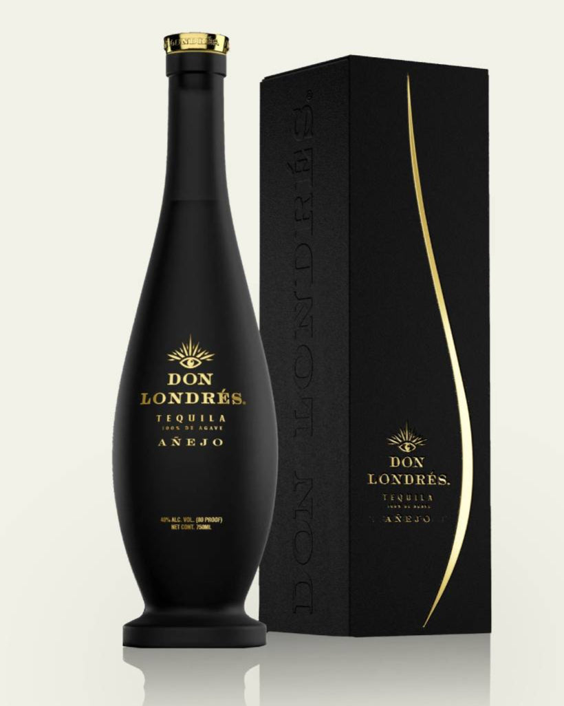 A sleek black bottle of Don Londres Añejo by My Store sits beside an elegant black box with gold accents, both set against a light background—an eye-catching display for your Shopify storefront.