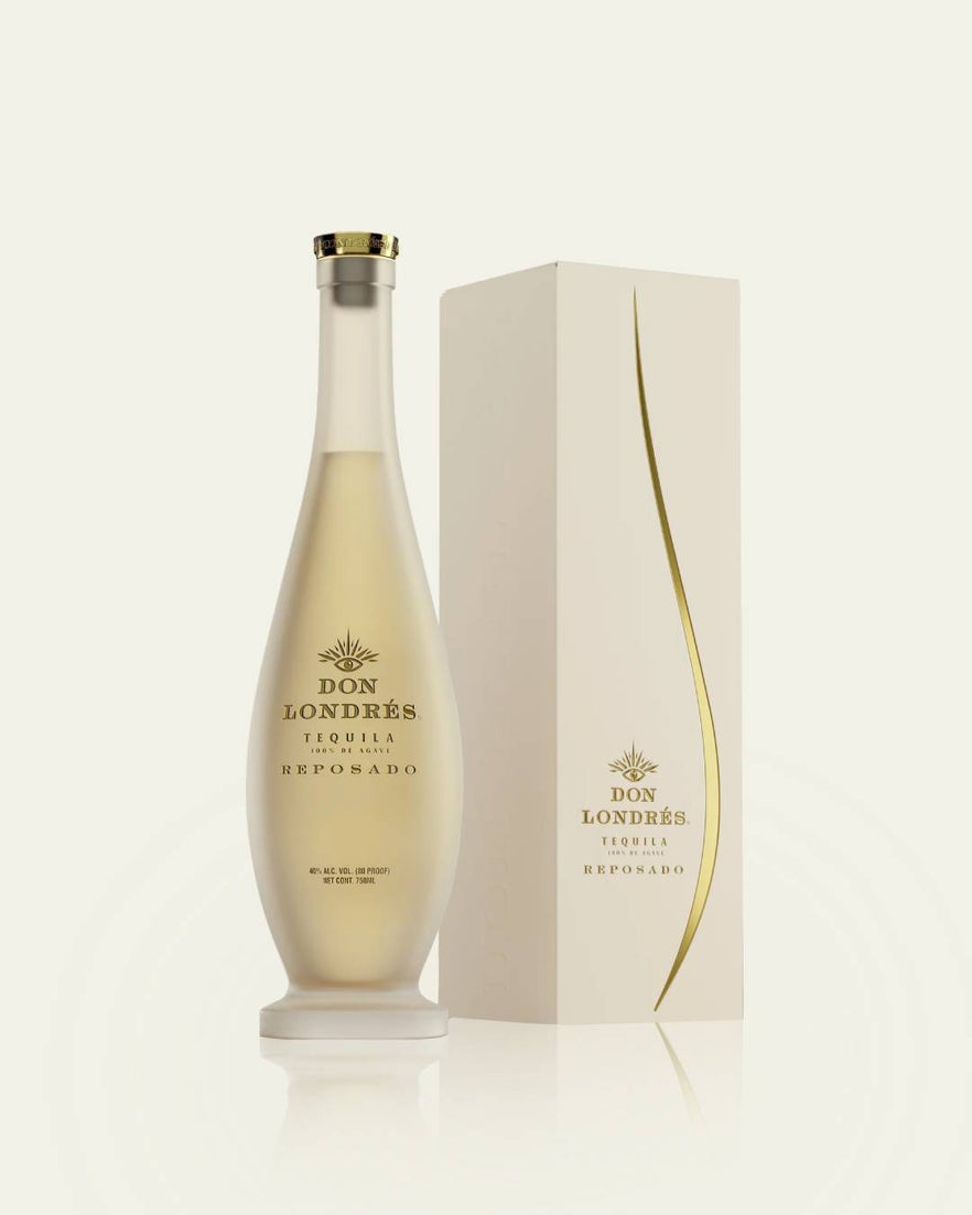 A tall, elegant bottle of Don Londres Reposado from My Store stands beside its cream-colored box with gold accents, both featuring the brand name and product details.